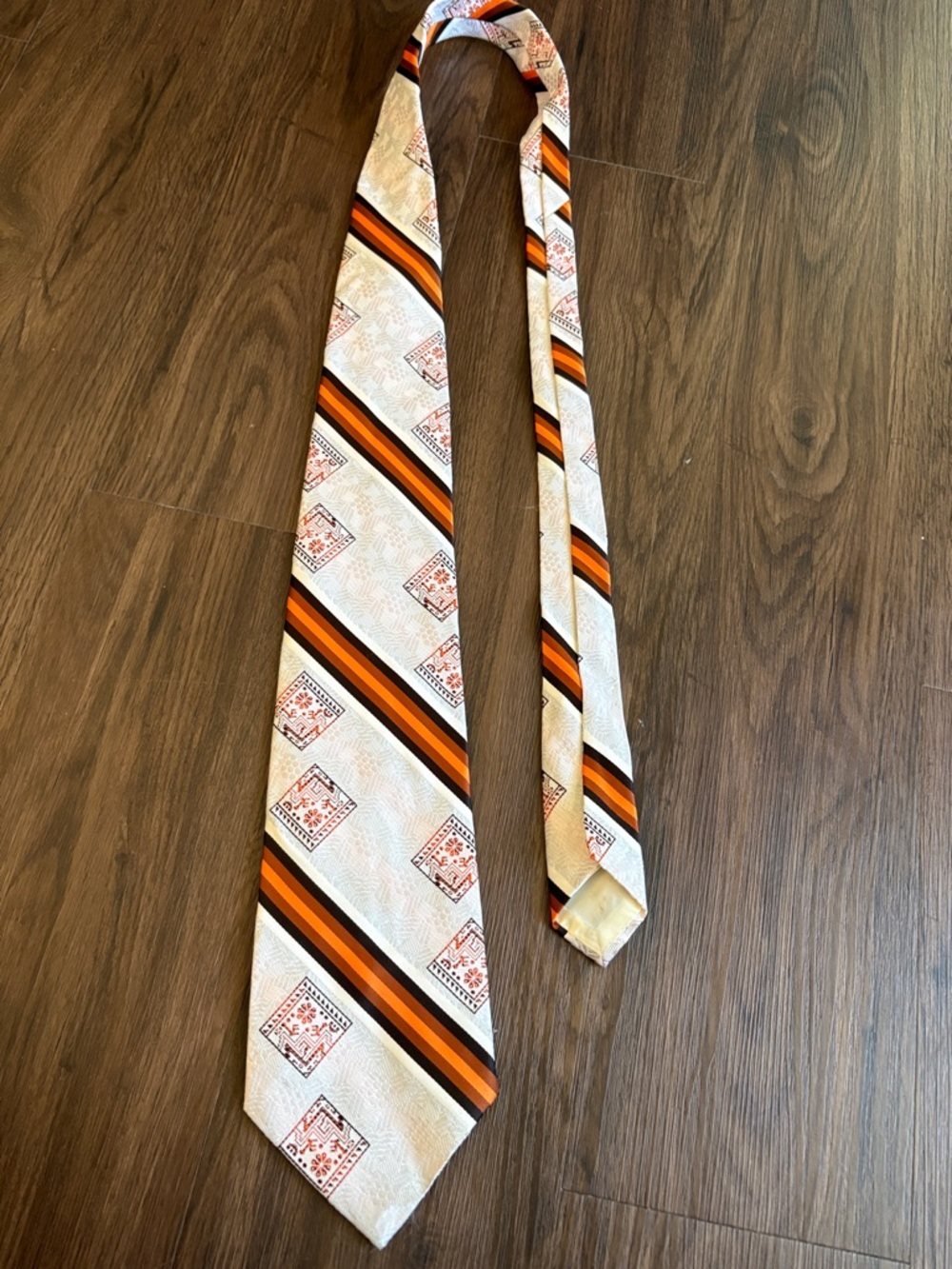 Cream Tie with Orange and Black Diagonal Stripes
